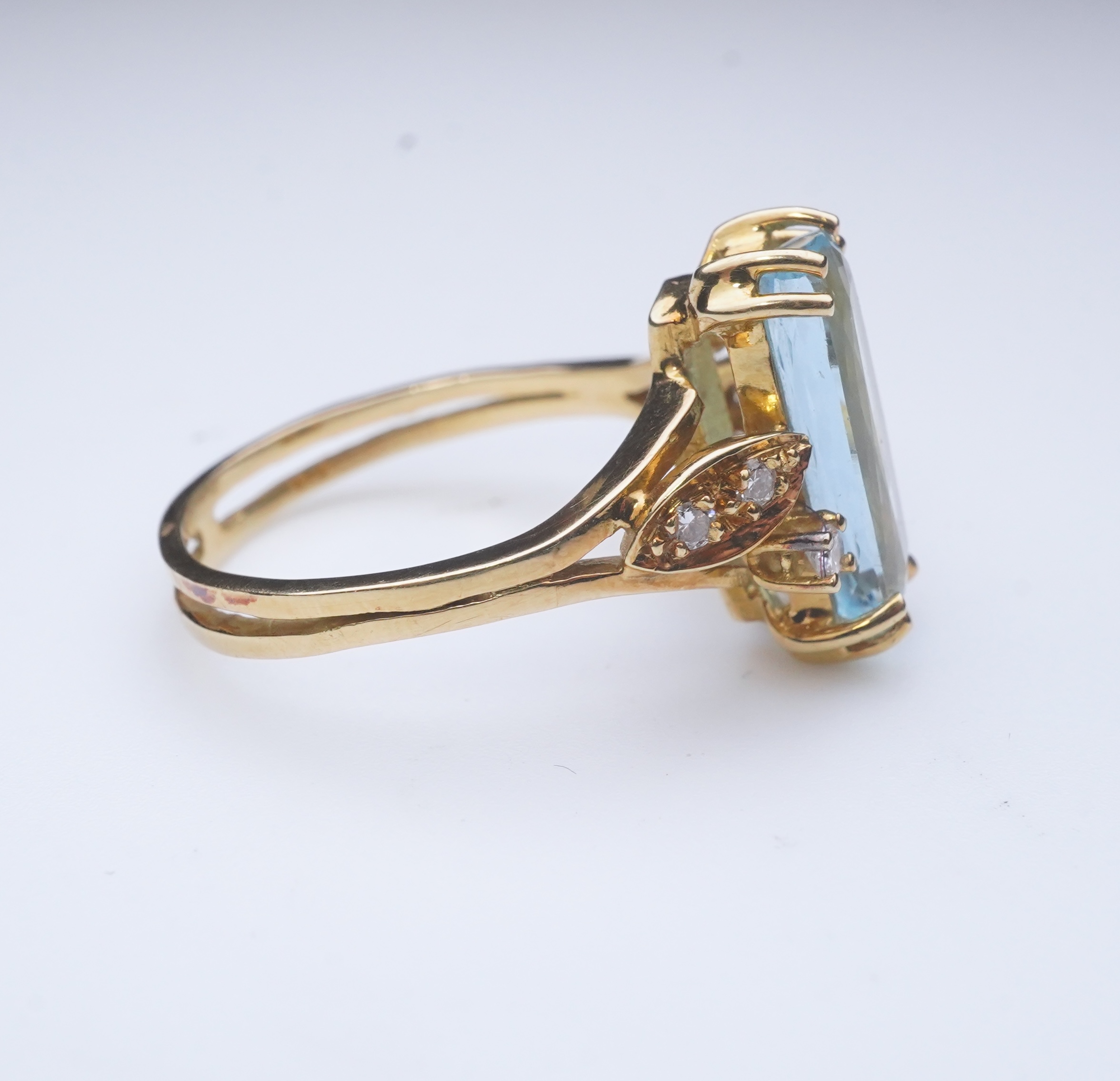 An aquamarine and diamond ring